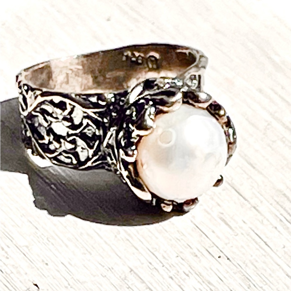 Authentic freshwater pearl surrounded with vintage 925 sterling silver